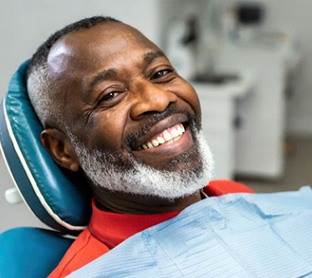 smiling older man in the dentist’s chair